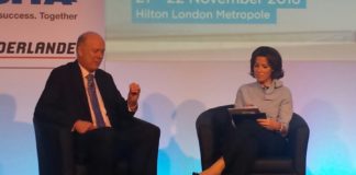 UK Government Secretary of State for Transport, Chris Grayling talks to conference moderator, Natasha Kaplinsky
